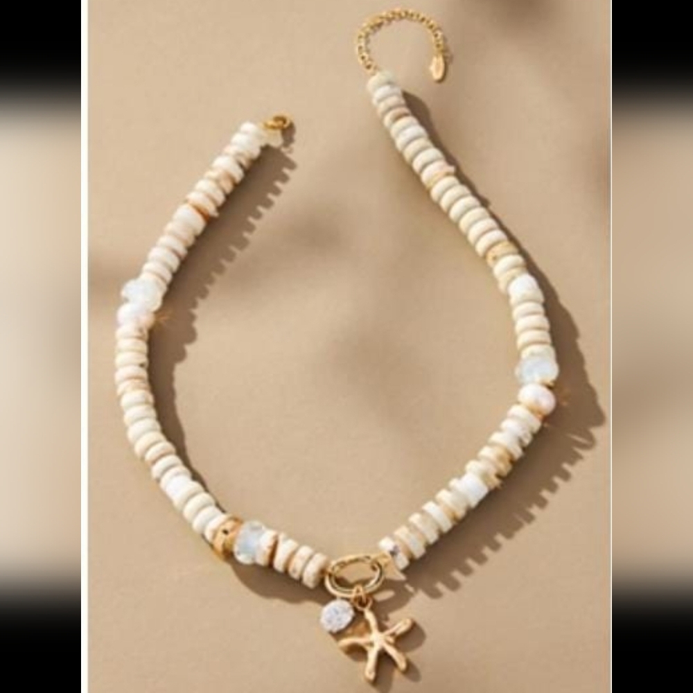 Anthropologie Cream and Gold Necklace with Starfish Charm